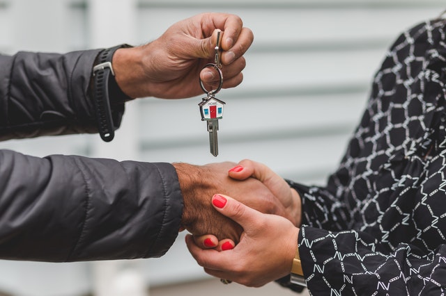 handshake handing over keys